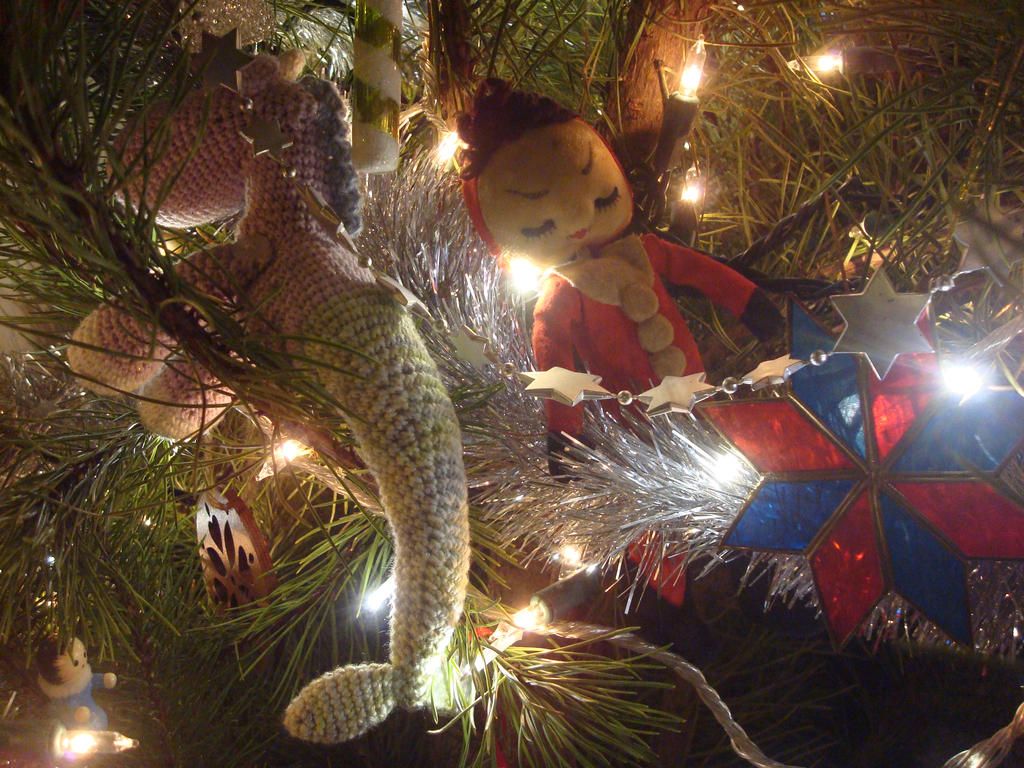 A mermaid unicorn Christmas tree with a blue and purple color scheme and seashell ornaments