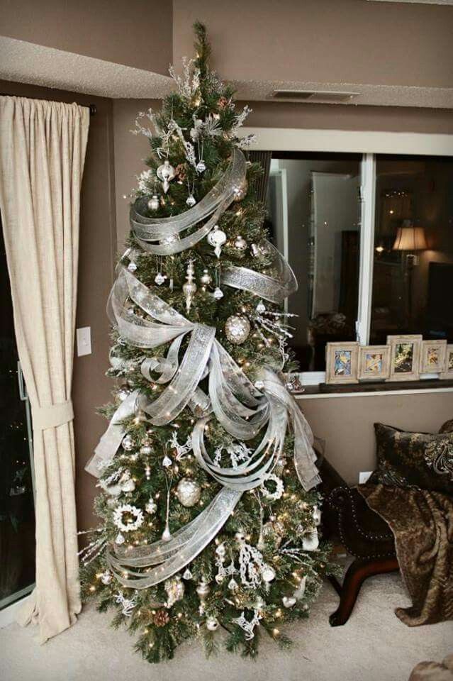 A silver ribboned Christmas tree