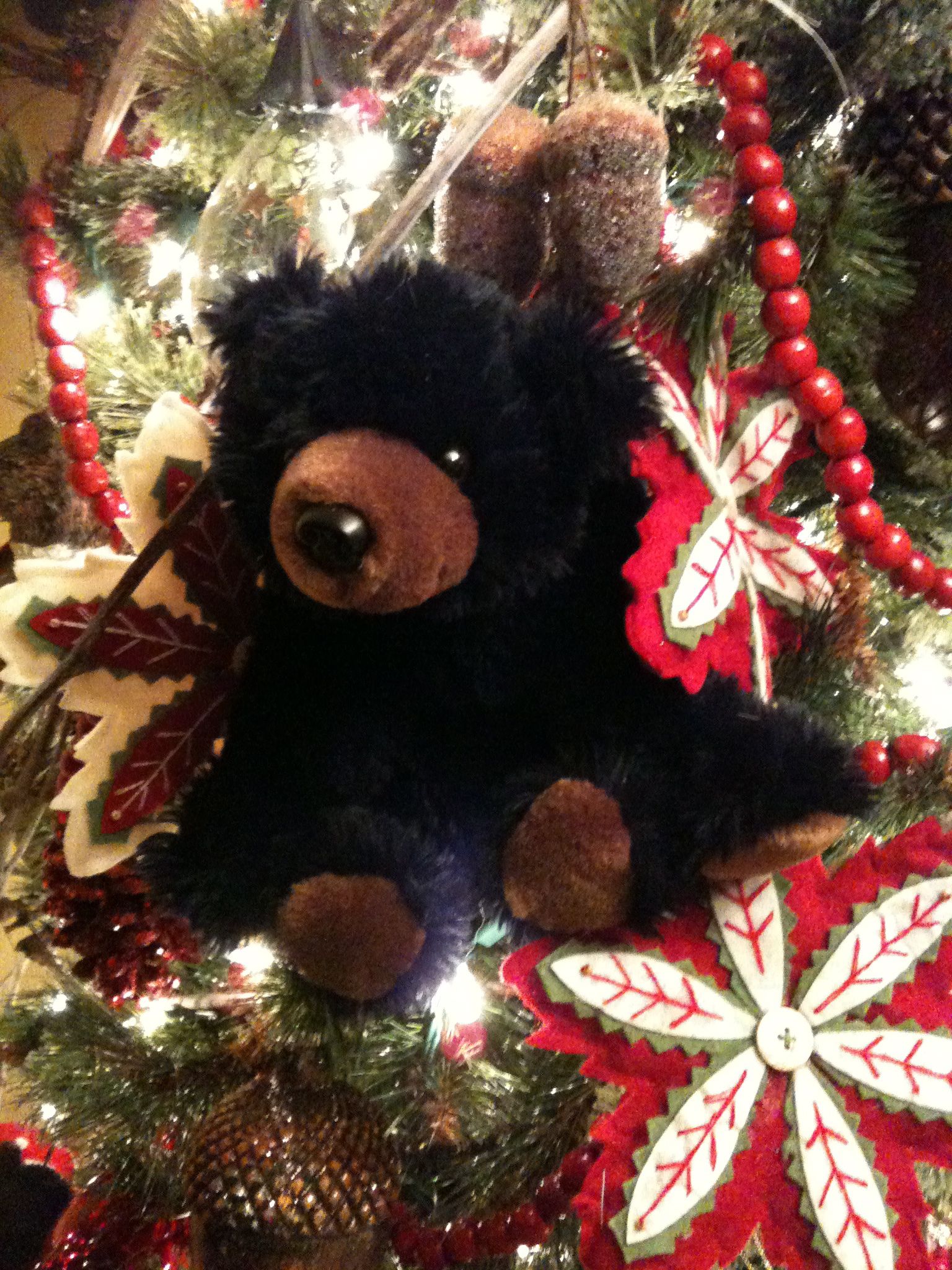 Black bear with Christmas tree decorations